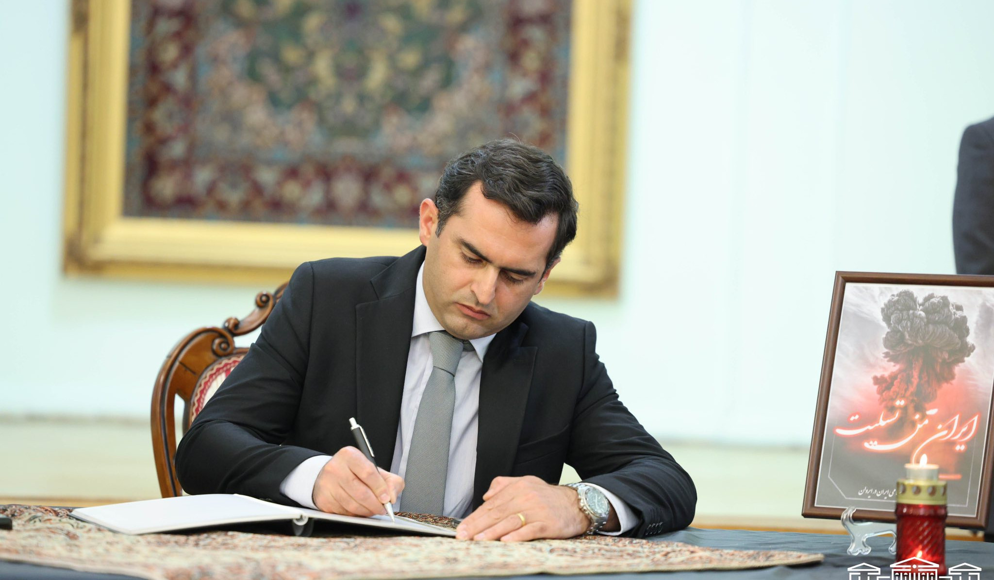 Hakob Arshakyan writes a condolence note in Book of Condolences opened at Iranian Embassy in Armenia