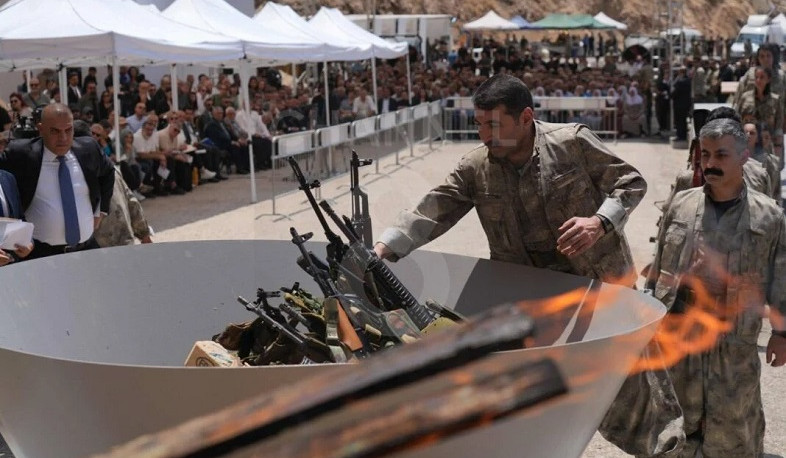 PKK fighters burn weapons during disarming ceremony in Iraqi Kurdistan
