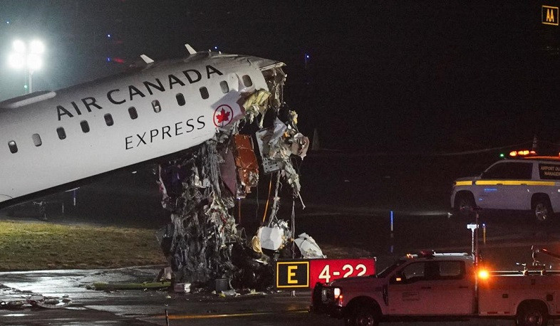 Emergency responders at New York's LaGuardia after jet collides with ground vehicle