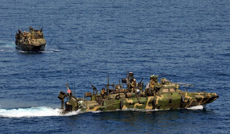 Iran threatens US forces in Strait of Hormuz after Trump says military will guide ships