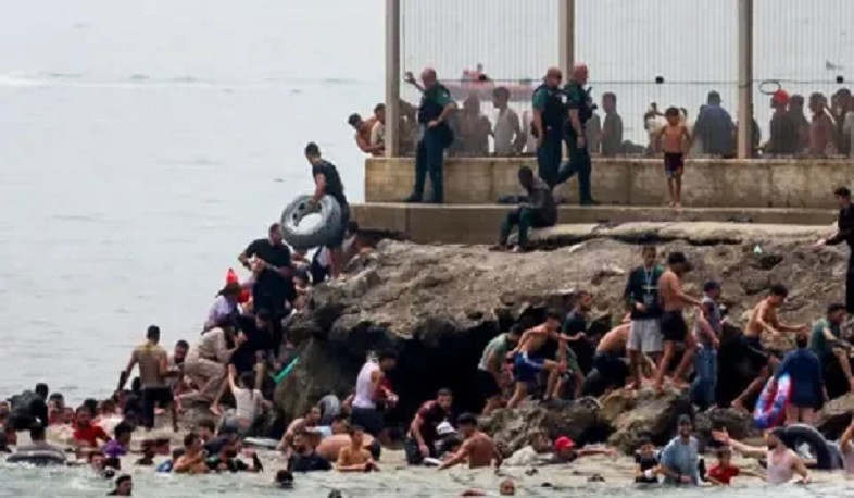 Migrants seen returning from Spain to Morocco at border crossing